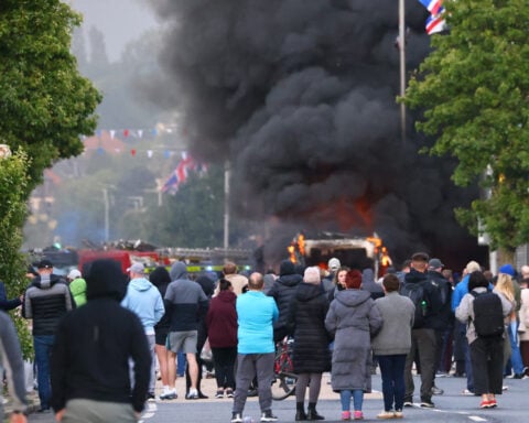 UK leaders call for calm as protests break out after Belfast street stabbing