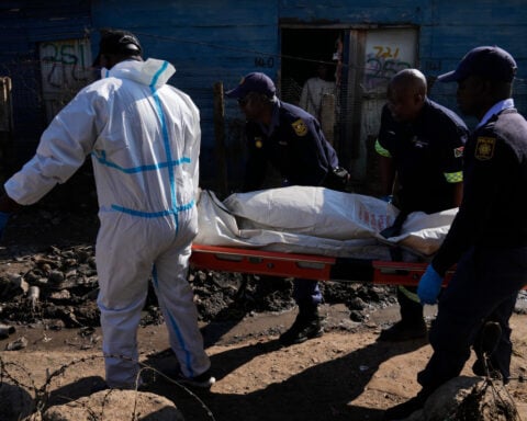Mass shooting leaves 12 dead and at least 9 hurt in an impoverished South Africa community