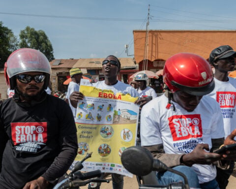 Motorcycle taxi drivers in Congo rally for Ebola awareness as attacks hinder response