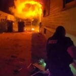 Photos show police officers jumping into action to save 4-year-old boy from house fire
