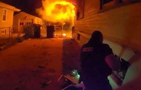 Photos show police officers jumping into action to save 4-year-old boy from house fire