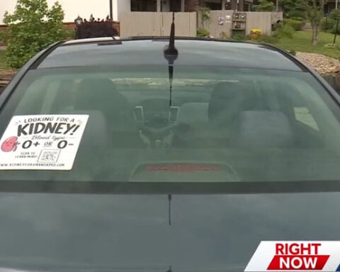 Spreading stickers for a solution: Woman using decals to find a kidney donor