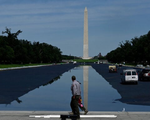 ‘Residual algae’ coats part of newly opened Reflecting Pool