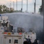 UK minister says violence in Northern Ireland is racist thuggery