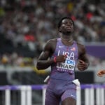 Athletics-United States' Tharp breaks 110m hurdles world record