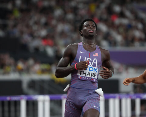 Athletics-United States' Tharp breaks 110m hurdles world record