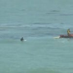 Rising tide catches sleeping beachgoers off guard