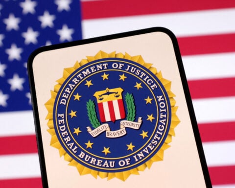 US Justice Department sues Virginia over mask ban