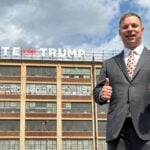Can the man behind a giant pro-Trump sign ride the president’s praise to Congress?