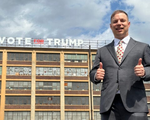 Can the man behind a giant pro-Trump sign ride the president’s praise to Congress?