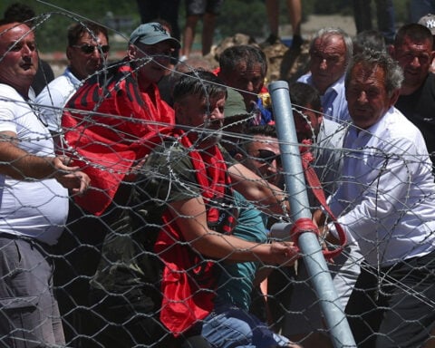 Protesters tear down Albanian development site fences, amid anger over coastal projects