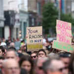 Thousands rally in Belfast to condemn anti-immigrant rioting that followed stabbing