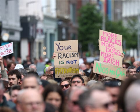 Thousands rally in Belfast to condemn anti-immigrant rioting that followed stabbing