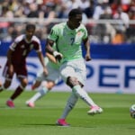 Boualem Khoukhi's goal on header in stoppage time earns Qatar a 1-1 World Cup draw with Switzerland