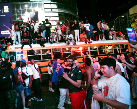 Mayhem mars euphoria as New York City celebrates the Knicks' first championship in 53 years