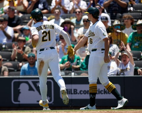Rockies set club record for runs with 23-9 victory over A's in Las Vegas heat