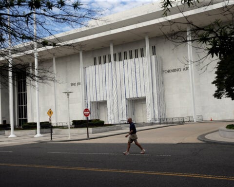 Kennedy Center exterior remains covered after Trump’s name is removed