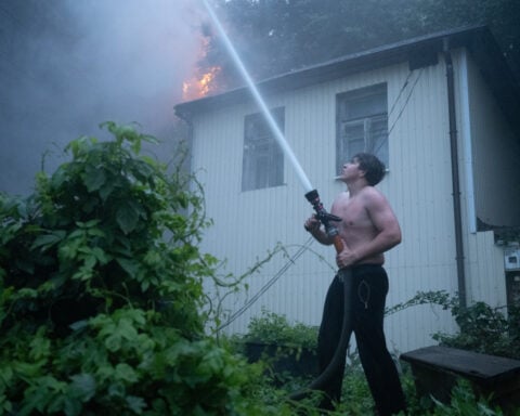Russian attack sets fire to centuries-old religious site in Kyiv and kills rescuers in Kharkiv