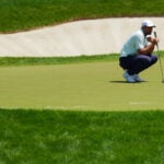 Golf-Scheffler hunts for history at tricky Shinnecock Hills