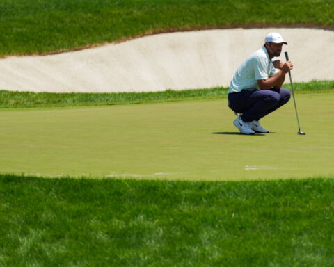 Golf-Scheffler hunts for history at tricky Shinnecock Hills
