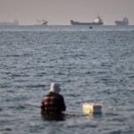 Trump says the Strait of Hormuz is reopened. But most ships are staying put