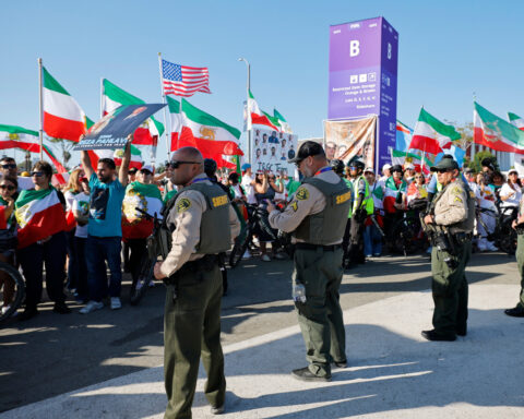 Some Iranian Americans wave protest flags, others cheer as Iran play World Cup opener