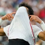 Iran opens a politically charged World Cup by playing to a 2-2 draw with New Zealand