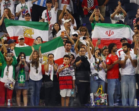 Soccer-Boos, cheers and a draw: Iran's World Cup opener reflects deep divisions