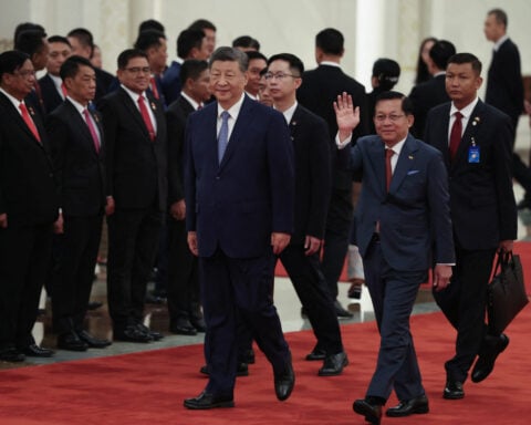 China embraces Myanmar's president as former junta chief seeks legitimacy