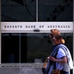 Australia central bank holds rates, warns hikes might not be over