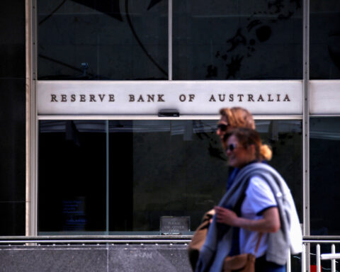 Australia central bank holds rates, warns hikes might not be over