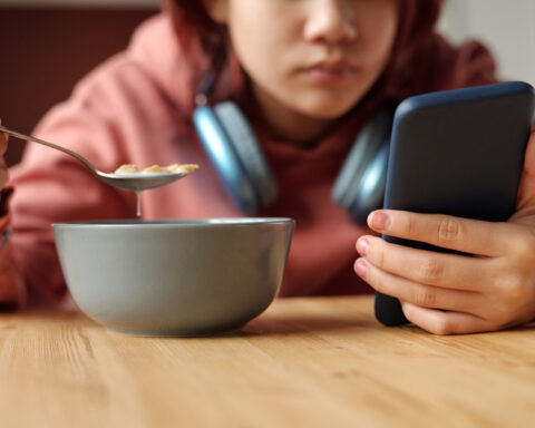 Parents are on devices during meals even more than their kids. Here’s how to rethink family dinner
