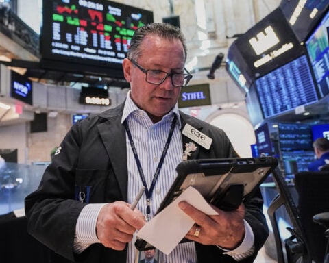 Oil drops below $80 per barrel, while tech stocks weigh on a mixed Wall Street