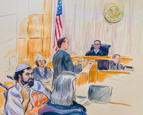 Suspect in deadly shooting of National Guard troops pleads not guilty to new charges