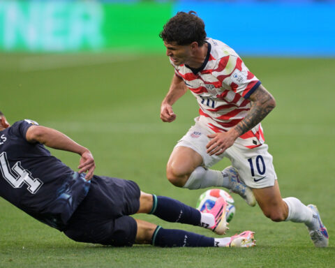 US forward Christian Pulisic practices on his own in calf injury rehab, team says he is 'day to day'