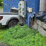 Four households evacuated after pickup truck crashes into apartment building