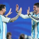Messi has his first World Cup hat trick as defending champion Argentina beats Algeria 3-0 in opener