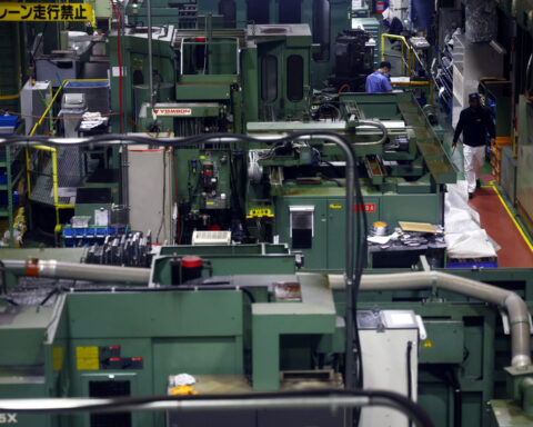 Japan manufacturers' sentiment rises for second month on chip-driven demand: Reuters Poll