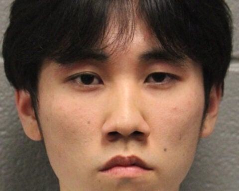 Man who admits setting cross on fire in Chicago park is charged with a hate crime
