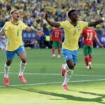 Brazilian soccer fans at the World Cup heed warning not to dress Rocky statue in team gear