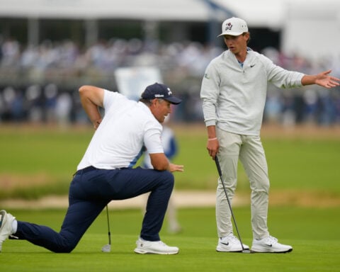 Well done, young man: 17-year-old Russell's US Open debut impresses 54-year-old partner Harrington