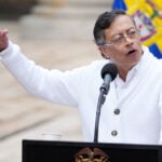 About 100 Colombian guerrilla dissidents disarm under peace talks with government