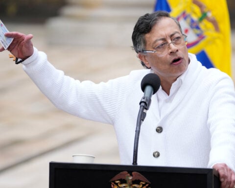 About 100 Colombian guerrilla dissidents disarm under peace talks with government