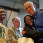 Barack and Michelle Obama surprise first visitors to newly opened presidential center