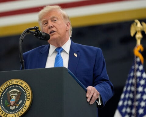 President Donald Trump unveils the new Air Force One, a converted Qatari jet