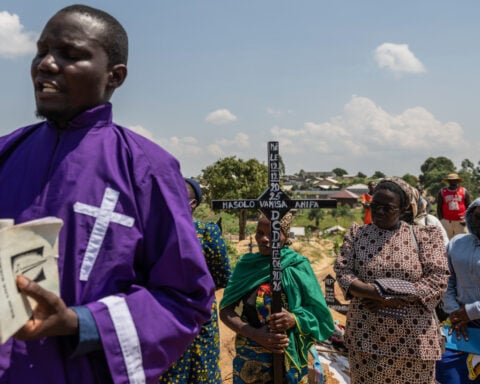 Mourners bury a 6-month-old Ebola victim in the Congo outbreak's third orphanage death
