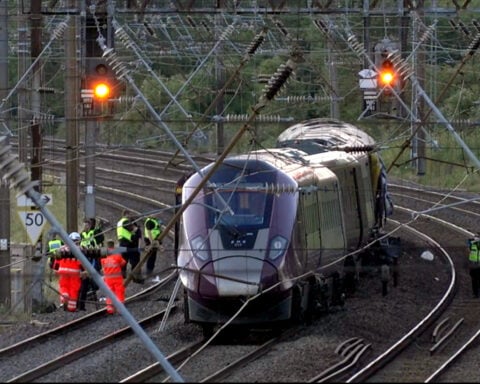 Two trains collide north of London, killing at least 1 person and seriously injuring dozens