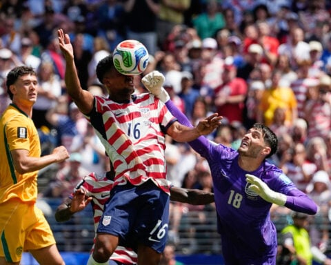 US reaches World Cup knockout round and wins its group with 2nd straight victory, 2-0 over Australia