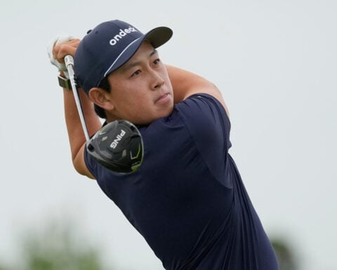 Dylan Wu laughs at himself after five-putting his first hole in the third round at the US Open