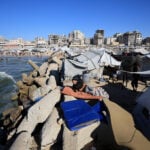 Gazans flee scorching tents for a polluted sea